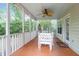 Cozy screened porch with a ceiling fan, offering a relaxing space for outdoor living at 1394 Center Lake Dr, Mount Pleasant, SC 29464