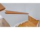 Hardwood staircase showcasing stained wood railing and white risers at 1394 Center Lake Dr, Mount Pleasant, SC 29464