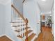 View of staircase with hardwood steps and white risers leading to the second floor at 1394 Center Lake Dr, Mount Pleasant, SC 29464
