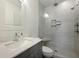 Modern bathroom with white marble shower, glass enclosure, and sleek vanity at 142 President St, Charleston, SC 29403
