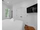 Clean bedroom design with white walls, wood floors, and large closet doors for storage at 142 President St, Charleston, SC 29403