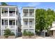 Well-manicured two-story home with double porches and quaint yard at 142 President St, Charleston, SC 29403