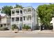 Charming two-story home with double porches and well-maintained landscaping at 142 President St, Charleston, SC 29403
