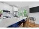 Bright kitchen featuring a large island, modern appliances, and natural light at 142 President St, Charleston, SC 29403