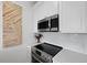 Modern kitchen featuring stainless steel appliances and white cabinets with subway tile backsplash at 142 President St, Charleston, SC 29403