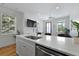Beautiful kitchen showcasing an island, stainless steel sink, and bright light at 142 President St, Charleston, SC 29403