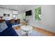 Inviting living room with a stylish kitchen bar and entertainment area at 142 President St, Charleston, SC 29403