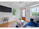 Comfortable living room featuring a TV, natural light and stylish furnishings at 142 President St, Charleston, SC 29403