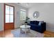 Cozy living room with a blue sofa, bright natural light and decor at 142 President St, Charleston, SC 29403