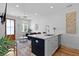 Open-concept space featuring a kitchen and living room area with stylish decor at 142 President St, Charleston, SC 29403