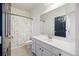 Bathroom boasts white vanity, a large mirror, and a tiled shower over tub at 1470 Ashley Gardens Blvd, Charleston, SC 29414