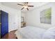 Bedroom featuring wood floors, a window, a closet, and a dark blue door at 1470 Ashley Gardens Blvd, Charleston, SC 29414