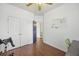 Bedroom with wood floors, closet, and open door leading to an adjacent bathroom at 1470 Ashley Gardens Blvd, Charleston, SC 29414
