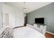 Bedroom with vaulted ceiling, gray accent wall, a ceiling fan, and wood floors at 1470 Ashley Gardens Blvd, Charleston, SC 29414