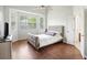 Bedroom with a bay window, ceiling fan, and beautiful wood floors at 1470 Ashley Gardens Blvd, Charleston, SC 29414