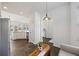 Bright dining area with slate floors leads to the kitchen and overlooks the backyard at 1470 Ashley Gardens Blvd, Charleston, SC 29414