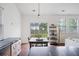 Open-concept dining area with a wooden table and chairs and backyard view at 1470 Ashley Gardens Blvd, Charleston, SC 29414