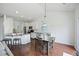 Open-concept dining area with a wooden table and chairs next to the kitchen at 1470 Ashley Gardens Blvd, Charleston, SC 29414