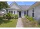 Charming home entrance with well-kept garden, gray siding, and blue shutters at 1470 Ashley Gardens Blvd, Charleston, SC 29414