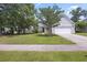 Inviting home with a well-manicured lawn, mature trees, and a two-car garage at 1470 Ashley Gardens Blvd, Charleston, SC 29414