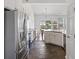 Bright kitchen with stainless steel appliances, white cabinets, and slate tile floors at 1470 Ashley Gardens Blvd, Charleston, SC 29414
