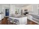 Bright kitchen featuring a breakfast bar, stainless steel appliances, and white cabinets at 1470 Ashley Gardens Blvd, Charleston, SC 29414