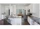 Bright kitchen with white cabinets, stainless steel appliances, and a breakfast bar at 1470 Ashley Gardens Blvd, Charleston, SC 29414