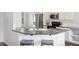 Charming kitchen featuring a breakfast bar with gray marble countertop and white cabinets at 1470 Ashley Gardens Blvd, Charleston, SC 29414