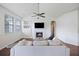 Comfortable living area with fireplace, built-in shelving, hardwood floors, and large windows at 1470 Ashley Gardens Blvd, Charleston, SC 29414