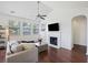 Cozy living room with vaulted ceilings, fireplace, built-ins, and lots of natural light at 1470 Ashley Gardens Blvd, Charleston, SC 29414