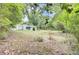 Exterior view of large backyard and home with screened-in porch at 1515 Mulberry St, Charleston, SC 29407