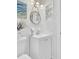 A stylish white bathroom with a vanity, decorative mirror, and modern fixtures offers a clean and elegant design at 1515 Mulberry St, Charleston, SC 29407
