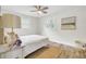 A serene bedroom with a plush bed, natural light, and views of the outdoors, perfect for relaxation at 1515 Mulberry St, Charleston, SC 29407