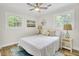 Cozy bedroom features beautiful natural light, neutral colors and a ceiling fan at 1515 Mulberry St, Charleston, SC 29407