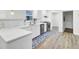 Well-lit kitchen with stainless steel appliances, light countertops, and plenty of cabinet space at 1515 Mulberry St, Charleston, SC 29407