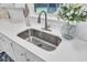 Modern sink features a goose neck faucet, natural light, and clean countertops at 1515 Mulberry St, Charleston, SC 29407