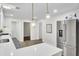 Bright kitchen with stainless steel refrigerator, pendant lighting, and ample countertop space at 1515 Mulberry St, Charleston, SC 29407