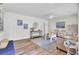 Bright living room with hardwood floors, neutral-toned furniture, and decor, offering a cozy and inviting atmosphere at 1515 Mulberry St, Charleston, SC 29407