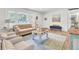 Inviting living room with large windows, cozy seating, and stylish decor at 1515 Mulberry St, Charleston, SC 29407