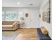 Cozy living room featuring wood floors, a comfortable sofa, and a stylish area rug, creating a relaxed atmosphere at 1515 Mulberry St, Charleston, SC 29407