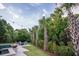 Backyard patio featuring a large swimming pool, spa, fire bowls, lounge chairs, and mature landscaping at 1566 Lindsey Creek Dr, Mount Pleasant, SC 29466