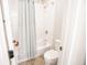 Bright bathroom featuring a shower with a tub, tile floors, and neutral walls at 1566 Lindsey Creek Dr, Mount Pleasant, SC 29466