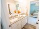 Bathroom featuring double sinks with granite countertops and white cabinets at 1566 Lindsey Creek Dr, Mount Pleasant, SC 29466