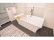 Elegant bathroom featuring a freestanding tub, subway tile shower, and stylish decor at 1566 Lindsey Creek Dr, Mount Pleasant, SC 29466