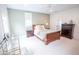 Spacious bedroom with a wooden bed frame, side tables, and decorative lamps at 1566 Lindsey Creek Dr, Mount Pleasant, SC 29466