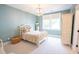 Charming bedroom with light blue walls, plush carpet, and white decorative furniture at 1566 Lindsey Creek Dr, Mount Pleasant, SC 29466
