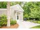 Exterior view of a home with a walkway, dark metal fence, tropical foliage, and a grill and bicycle at 1566 Lindsey Creek Dr, Mount Pleasant, SC 29466