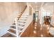 Bright hallway with hardwood floors, staircase, and inviting entryway views at 1566 Lindsey Creek Dr, Mount Pleasant, SC 29466