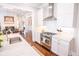 Modern kitchen featuring white cabinets, stainless steel appliances, and an island with marble countertop at 1566 Lindsey Creek Dr, Mount Pleasant, SC 29466