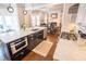 Open-concept kitchen with stainless steel appliances, marble countertops, and dark wood cabinets at 1566 Lindsey Creek Dr, Mount Pleasant, SC 29466